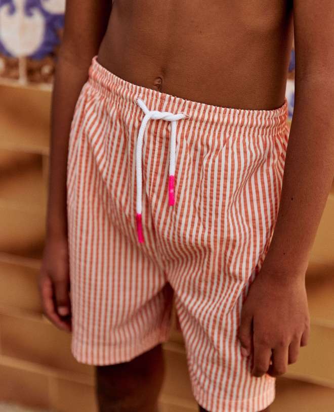 Tangerine orange seersucker swim shorts for boys by Canopea