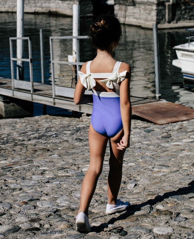 Girl wearing the Indigo blue sun protective swimwear Layla by Canopea