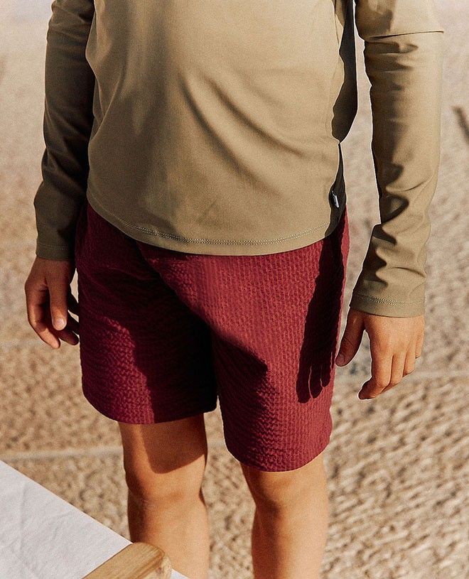 Red Marsala seersucker swim shorts for boys by Canopea