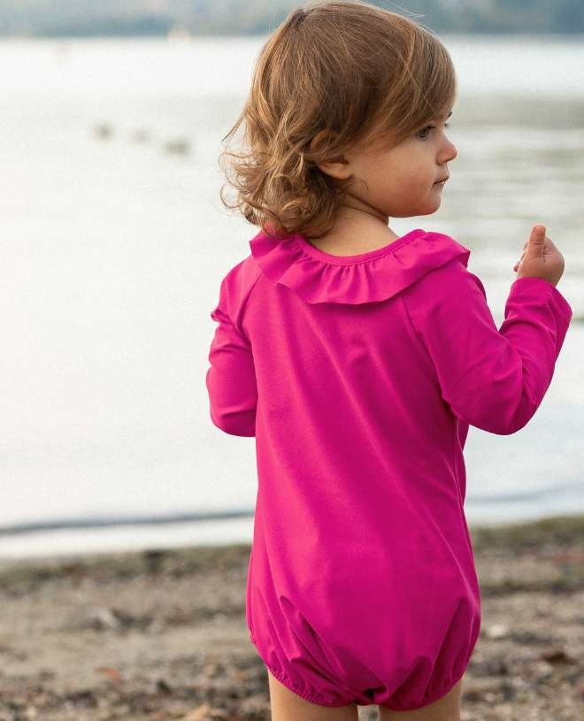 Long sleeve baby sun protective swimsuit in Fuschia pink by Canopea