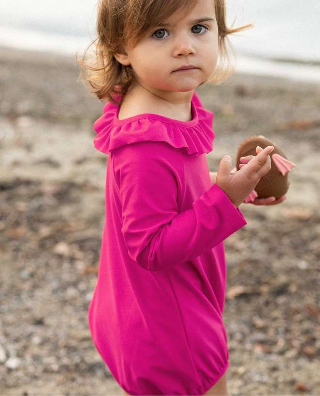 Long sleeve baby sun protective swimsuit in Fuschia pink by Canopea