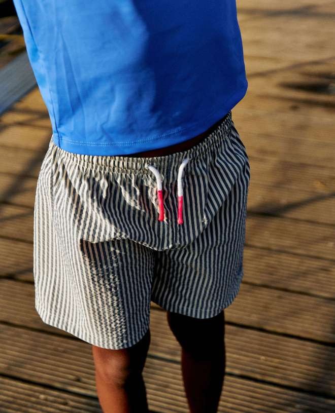 Blueberry seersucker swim shorts for boys by Canopea