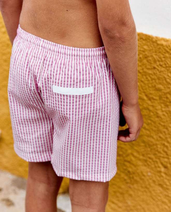 Fuschia seersucker swim shorts for boys by Canopea