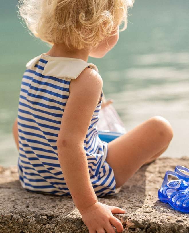 Sleevless baby sun protective romper in Cobalt Stripe color by Canopea