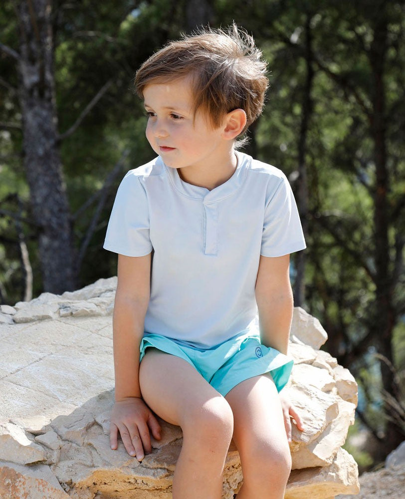 Boy wearing an Ash blue green sun protective rashguard for boy, baby and children