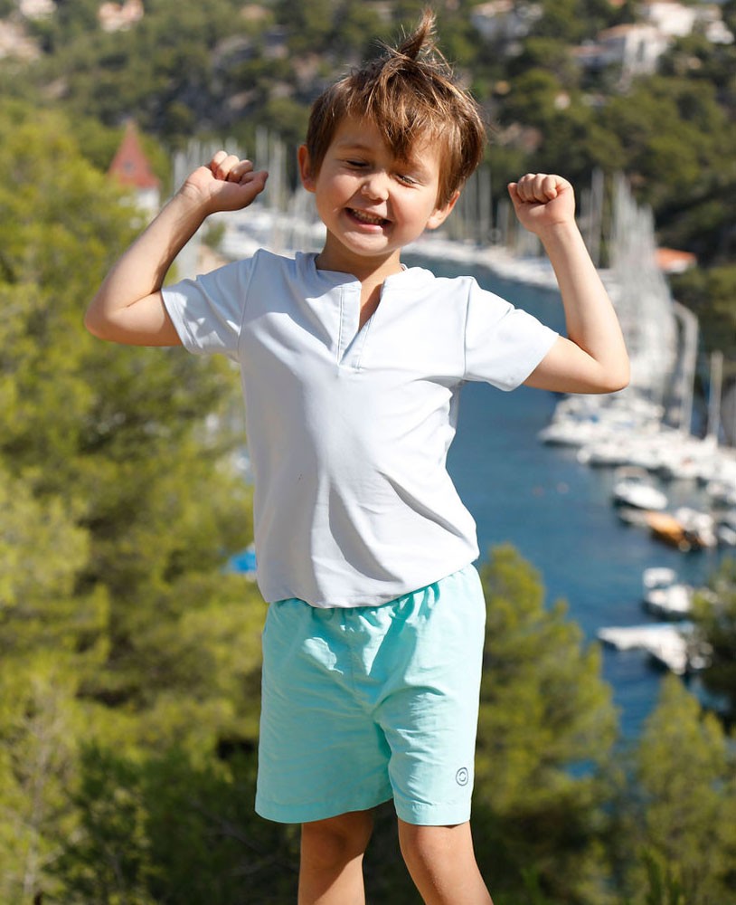 Boy wearing an Ash blue green sun protective rashguard for boy, baby and children