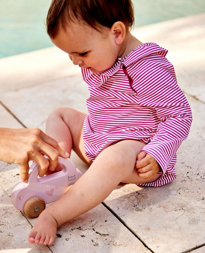 Maillot de bain anti-UV à manches longues pour bébé Daisy en Transat fuschia de CANOPEA